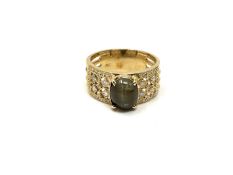 A 14ct gold chrysoberyl and diamond ring, size U. CONDITION REPORT: 7.