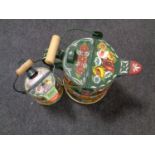 Two painted metal barge watering cans