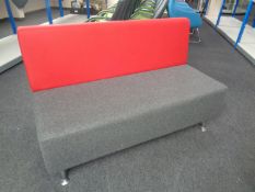 A pair of contemporary office settees upholstered in a red and grey fabric