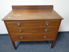 An Edwardian inlaid mahogany three drawer chest