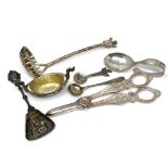 A group of silver and other items including caddy spoon, strainer, salt,