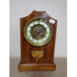 An Edwardian inlaid mahogany eight day mantel clock with brass and enamelled dial