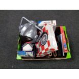 A box of miscellany to include a Cyberman helmet, Harry Potter audio CD's, stamp albums,