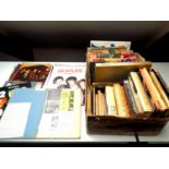A box of a large quantity of books and calendars relating to The Beatles,