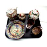 A tray containing 20th century oriental wares to include famille rose teapot with wicker handle,