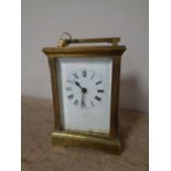 A brass cased carriage clock with key