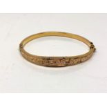 An antique 9ct gold hinged bangle (a/f) CONDITION REPORT: 5.