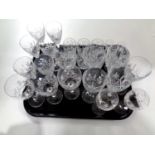 A tray containing assorted lead crystal drinking glasses to include Edinburgh Crystal