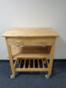 A pine kitchen trolley fitted two drawers