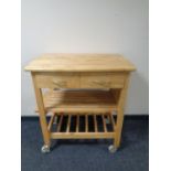 A pine kitchen trolley fitted two drawers