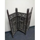 A 19th century carved hardwood three way folding screen