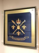 An HMS Monarch painted silk insignia, framed.