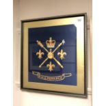 An HMS Monarch painted silk insignia, framed.