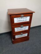 A reproduction mahogany three drawer chest