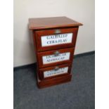 A reproduction mahogany three drawer chest