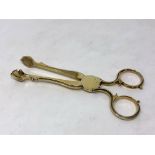 A good pair of early George III silver gilt sugar scissor nips, circa 1775, Hennell,