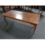 A mahogany rectangular coffee table on pad feet