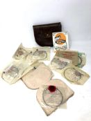A mid twentieth century leather Hardy fishing wallet containing numerous fishing casts