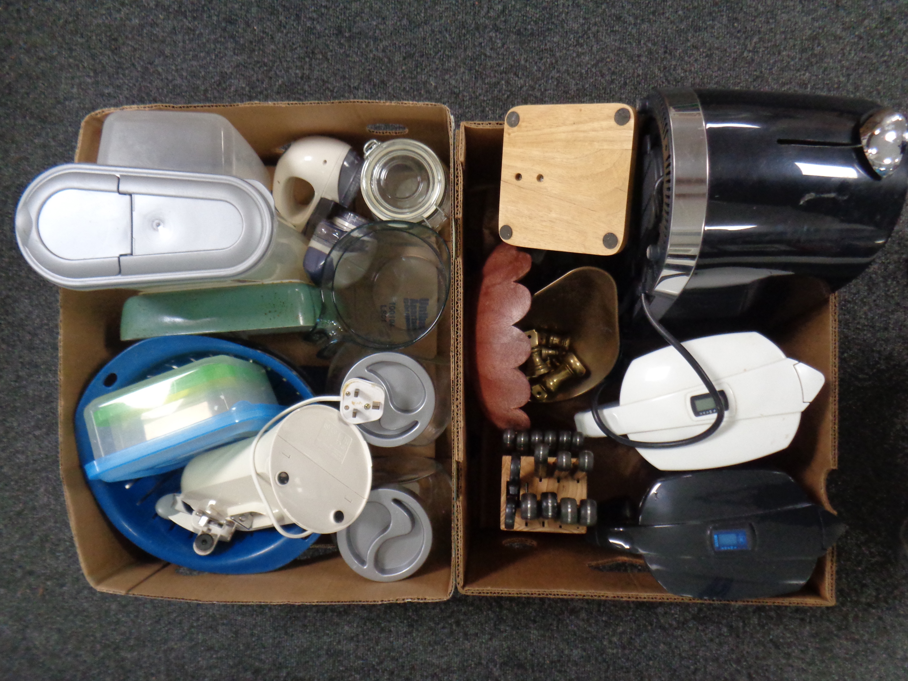 Two boxes containing kitchen ware to include toaster, water filter jugs,