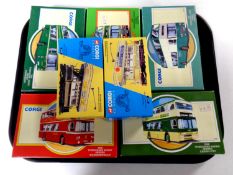 A tray containing seven Corgi die cast buses and trams (boxed)