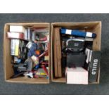 Two boxes containing paint brushes, cased socket sets, drill bits, sander, glue gun,