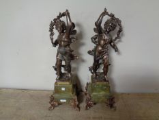 A pair of antique French spelter figures of cherubs on green marble bases, Printemps et Automne,