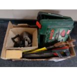 A box of vintage flat iron, hand saws,