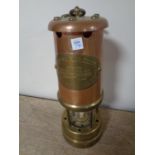 A copper and brass British Coal Mining lamp