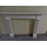 A contemporary painted fire surround
