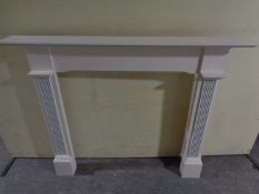 A contemporary painted fire surround