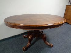 A Victorian oval pedestal breakfast table