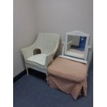 A painted wicker basket chair together with an upholstered footstool and a painted dressing table