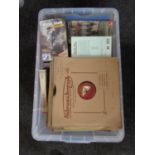 A plastic crate containing a large quantity of 78s, CDs, cassettes and VHS tapes,