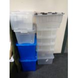 A quantity of plastic storage boxes with lids