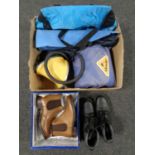 A box of sleeping bag, mats, folding tripod seat, cool bag,