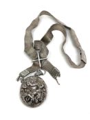 A large Indian silver locket with woven silver collar, 71.7g.