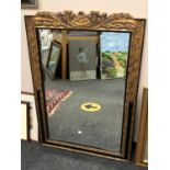 An ornate bevelled mirror,