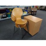 A set of four contemporary beech stacking chairs on metal legs together with a three drawer office