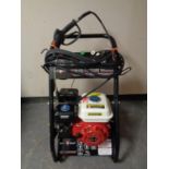 A Swiss Kraft 2500 PSI petrol washer on trolley