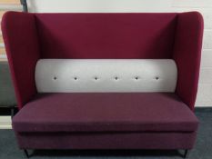 A contemporary high backed booth settee upholstered in a two-tone purple and grey fabric