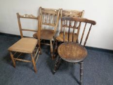 A pine dining table, a pair of beech kitchen chairs,