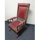 An American style rocking chair upholstered in a red fabric