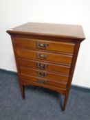 An Edwardian five drawer music chest