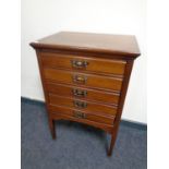 An Edwardian five drawer music chest