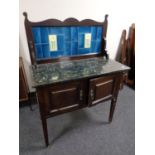 An Edwardian marble topped tiled back wash stand