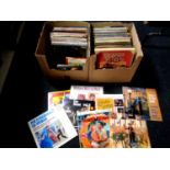 Two boxes containing LPs and LP box sets to include musicals, Singing in the Rain, Mary Poppins,