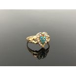 An antique 15ct gold turquoise and seed pearl heart shaped ring