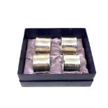 Four heavy silver plated napkin rings