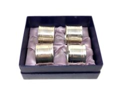 Four heavy silver plated napkin rings