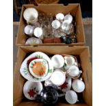 Two boxes containing part china tea services, commemorative goblets, vintage camera,
